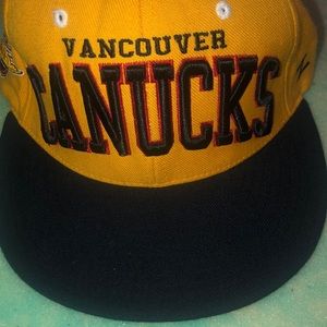 Vancouver Canucks gold and black hat